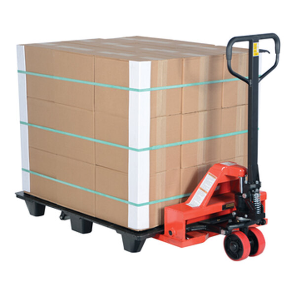 A Vestil steel low profile pallet truck with a large stack of boxes on it.