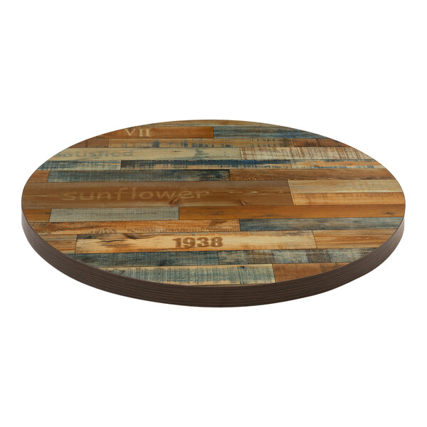 An American Tables & Seating round wood table top with light blue wood grain and Yangon wood plank style.