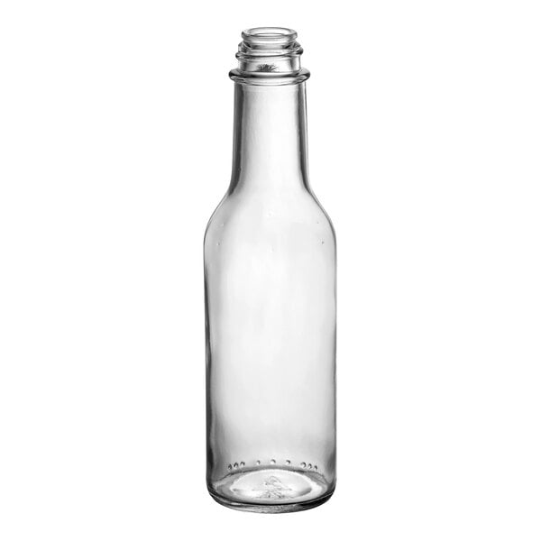 A clear 5 oz. glass woozy bottle with a narrow neck and 24/414 finish.