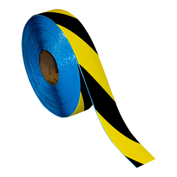 A roll of blue and black striped Superior Mark safety tape with yellow stripes.