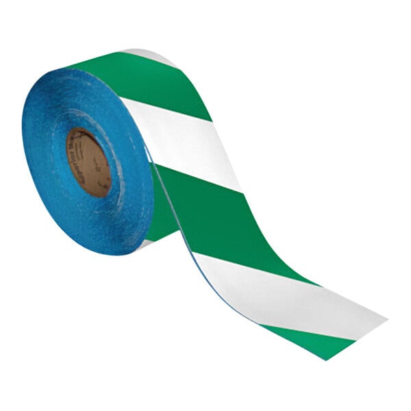 A roll of green and white striped Superior Mark safety tape.