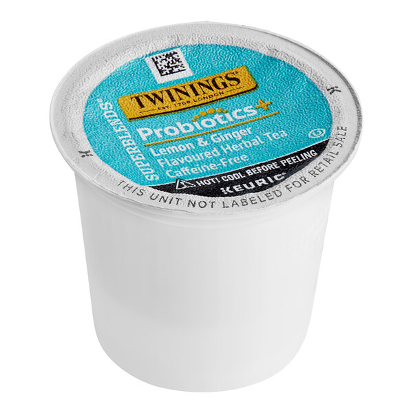 A white Twinings container with a blue label for Twinings Probiotics Lemon & Ginger Herbal Tea K-Cup Pods.