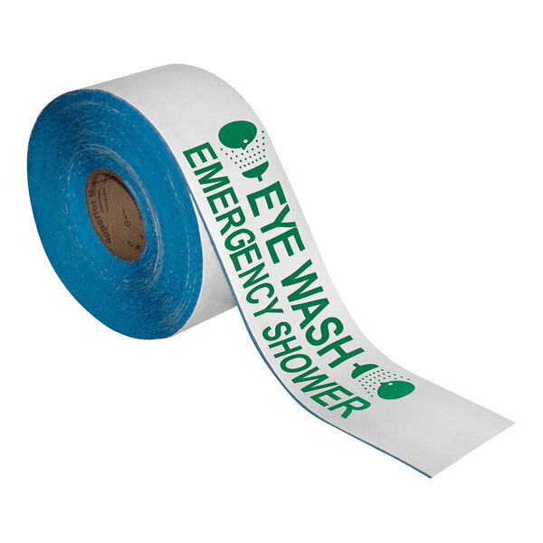 A roll of white and green Superior Mark safety tape with the words "Eye Wash Emergency Shower" on it.