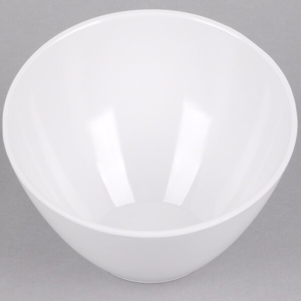 An American Metalcraft white melamine serving bowl on a gray surface.