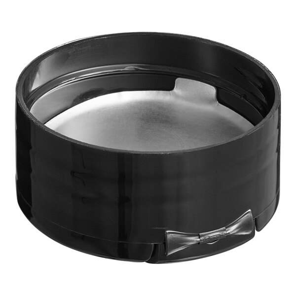 A black circular metal lid with 5 silver holes.