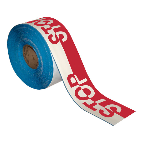 A roll of red and white Superior Mark safety tape with the word "Stop" in white.