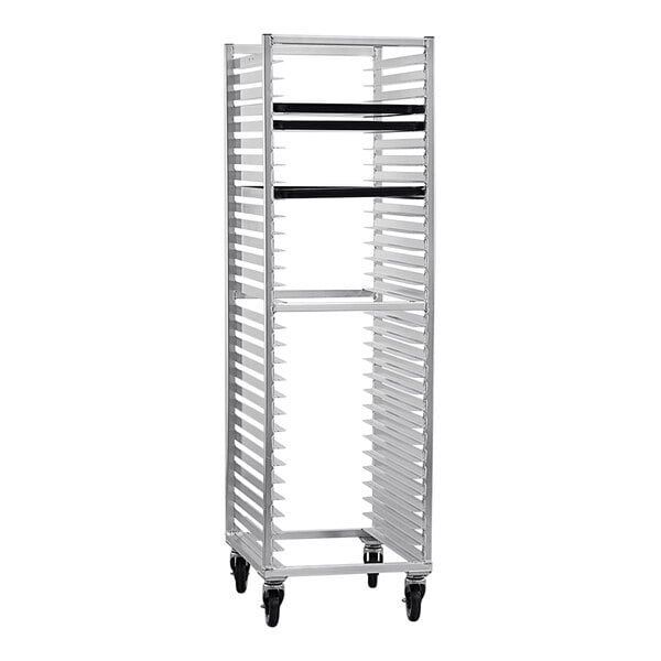 A white metal New Age sheet pan rack with black wheels.