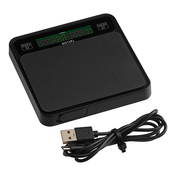 A black electronic Taylor coffee scale with a digital display and a cord.