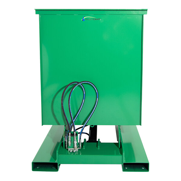 A Valley Craft green steel self-dumping hopper with wires attached.