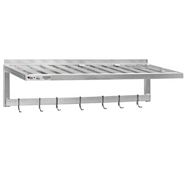 A metal wall shelf with pot rack hooks.