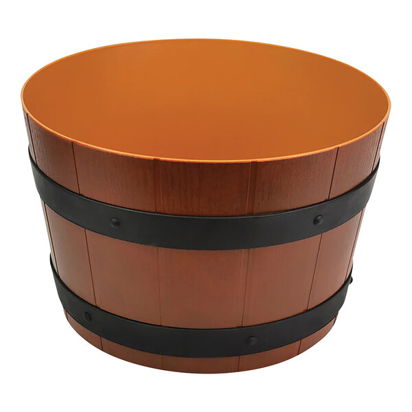 A wooden barrel with black bands around it.