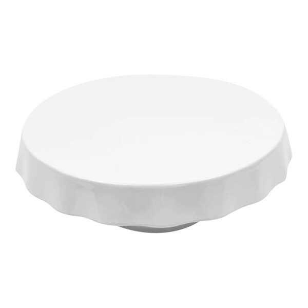 A white melamine round cake stand with a white rim.