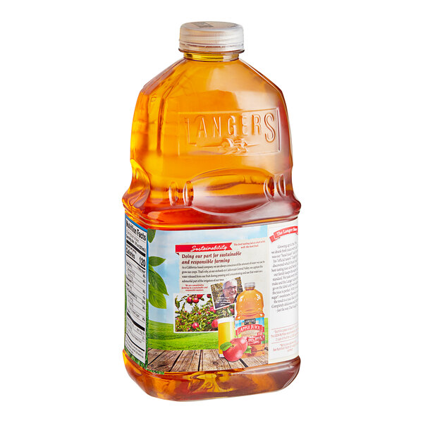 A close up of a Langers Apple Juice bottle with a label.