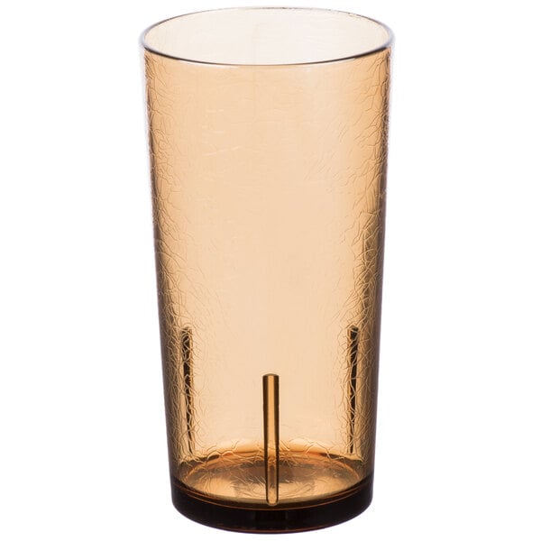 A close-up of a light amber Cambro plastic tumbler with a crackle pattern.