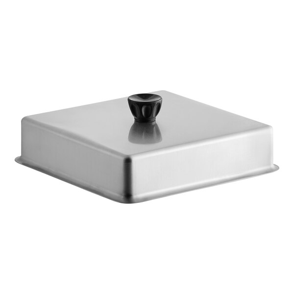 A silver square aluminum basting cover with a black handle.