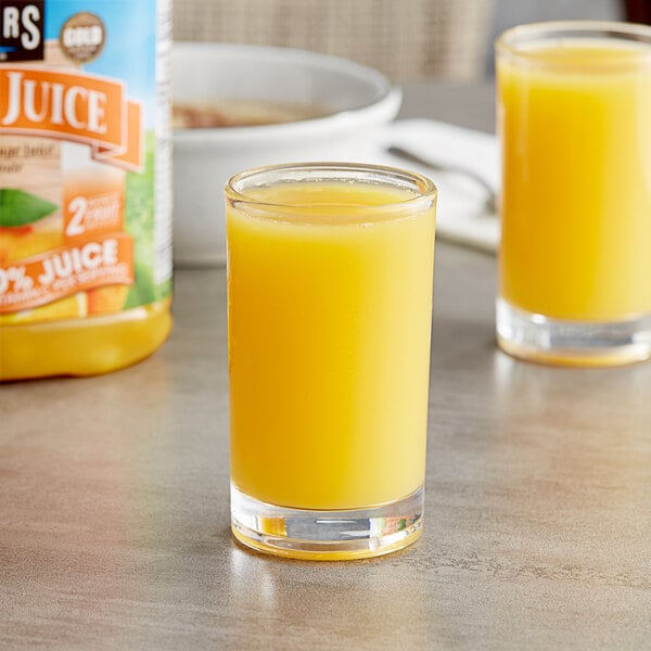 A close-up of two glasses of Langers Orange Juice