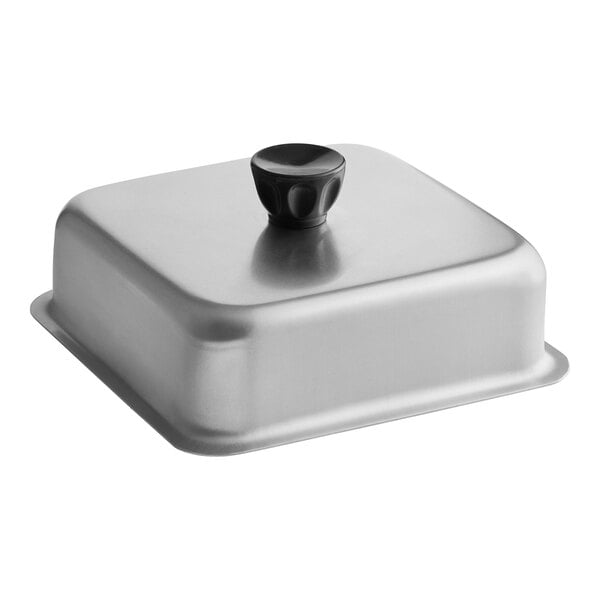 A silver square aluminum basting cover with a black handle.