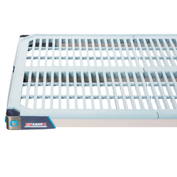 A white plastic grate with black stripes on a MetroMax shelf.