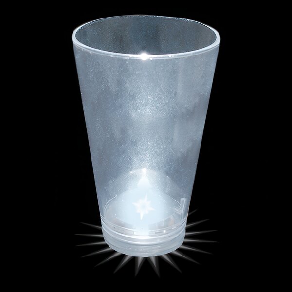 A clear plastic shot cup with a white light on top.