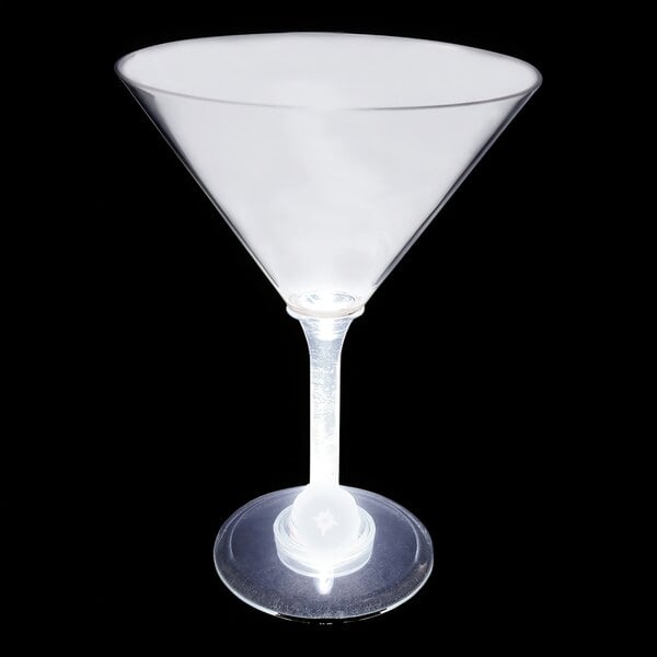 A clear plastic martini glass with a white LED light inside it.