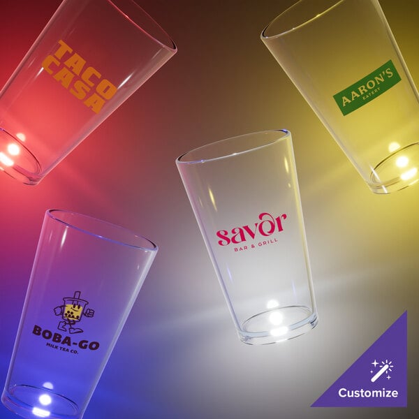 A group of customizable clear plastic pint cups with white LED lights.
