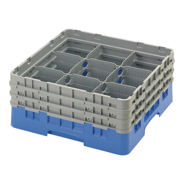 A blue plastic Cambro glass rack with nine compartments.