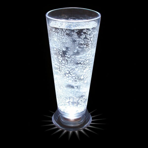 A customizable plastic pilsner cup with a white LED light shining in it.