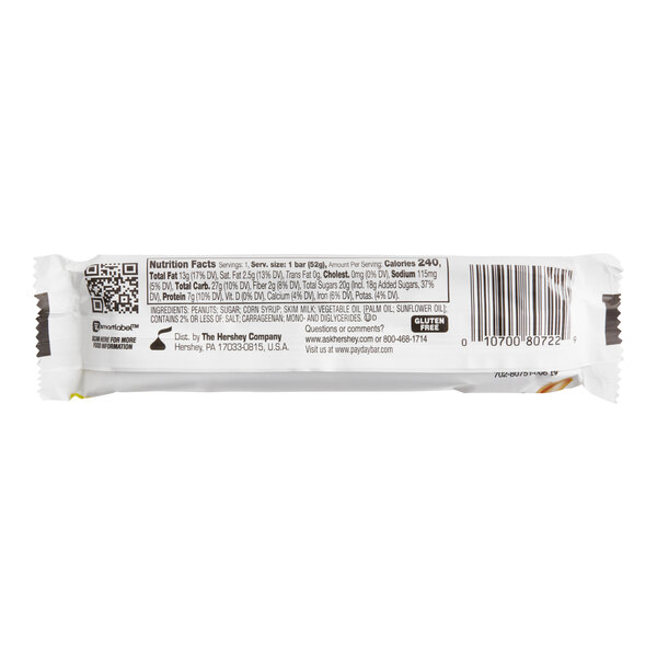 A close-up of a PAYDAY Peanut Caramel Candy Bar with a product label.