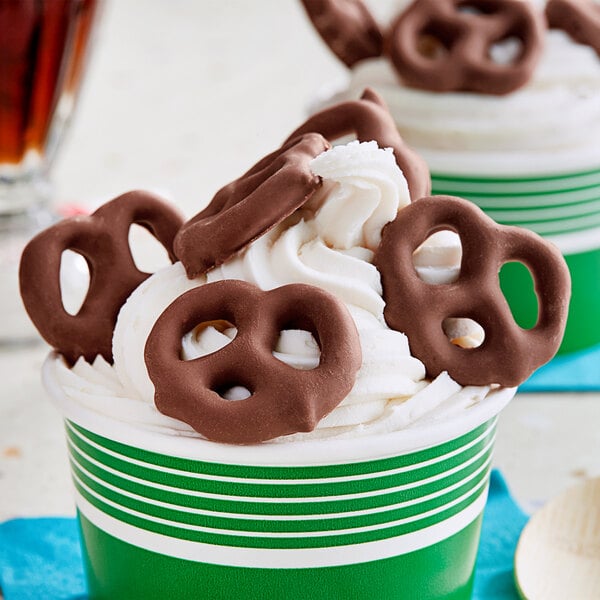 A chocolate covered pretzel on a white background.