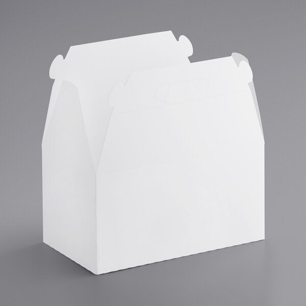 A white Barn take-out lunch box with handles.