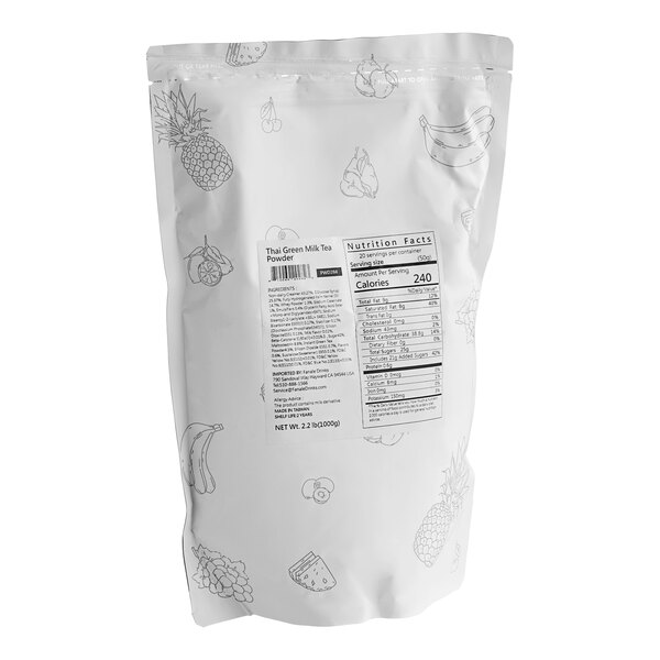 A white bag of Fanale Thai Green Tea Milk Powder Mix with black and green text and fruit on it.