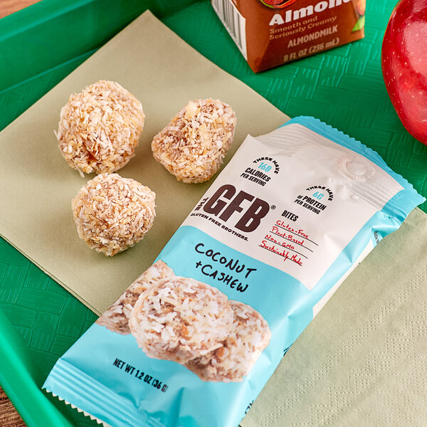 A tray with a package of The GFB Coconut Cashew Bites.