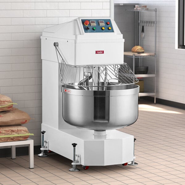 An Estella spiral dough mixer in a kitchen with white floors.