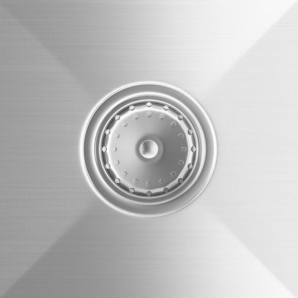 A close-up of the drain on a Steelton stainless steel circular sink bowl.