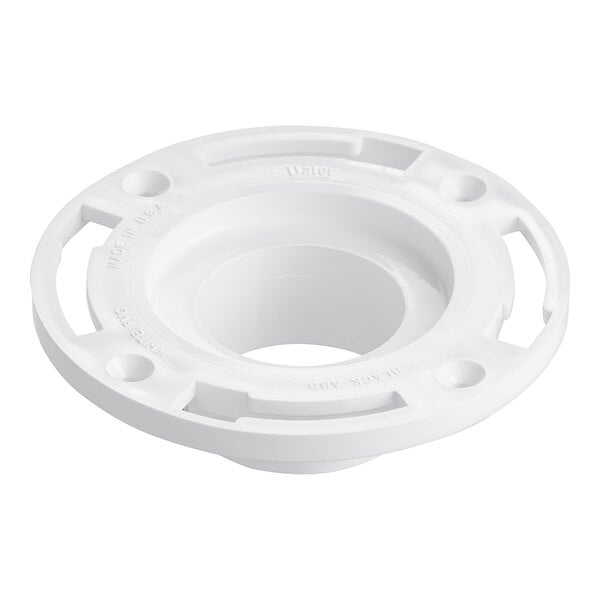 A white plastic circular Oatey water closet flange with holes in it.