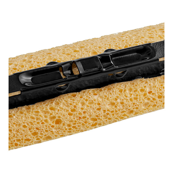 A close up of a yellow Lavex cellulose sponge mop head.