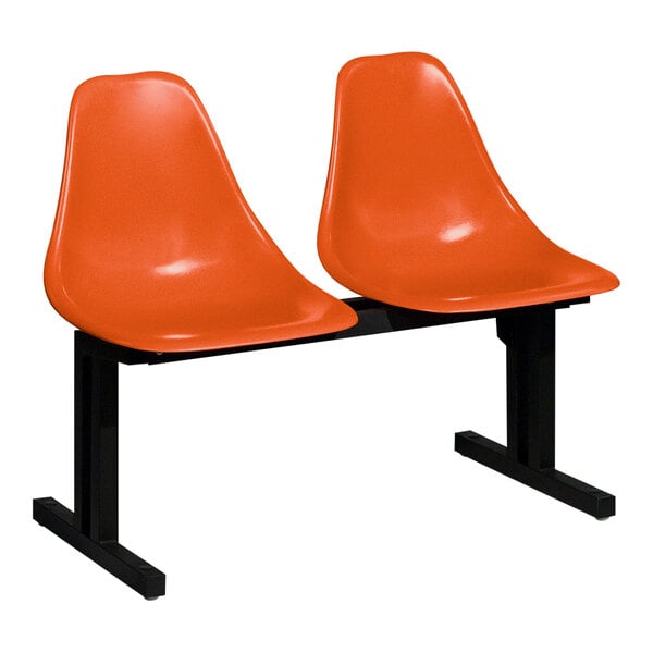 Two Sol-O-Matic orange plastic chairs with black legs on a white background.