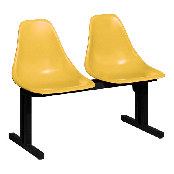 A Sol-O-Matic modular seating unit with two yellow plastic chairs on a black base.
