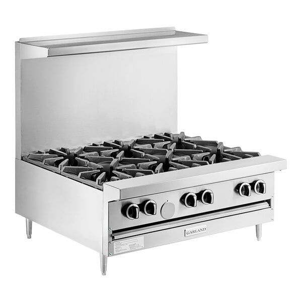 A stainless steel Garland countertop gas range with six burners.
