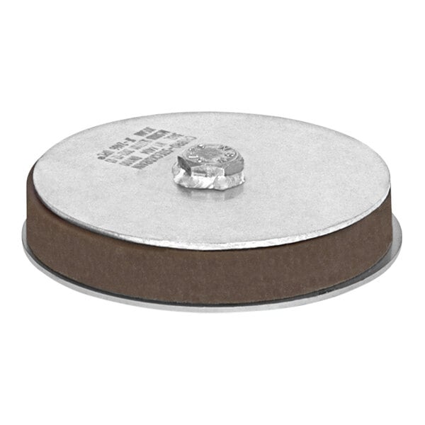 A round stainless steel Josam expansion plug with a small hole in the center.