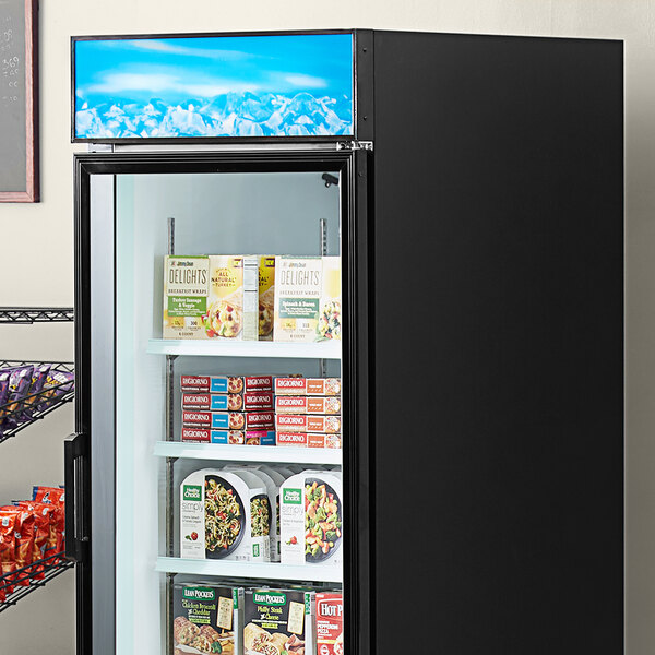 A blue Avantco sign panel above shelves in a refrigerator.