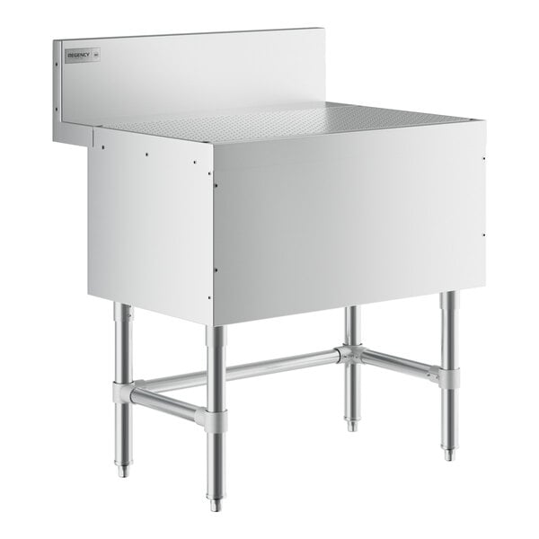A Regency stainless steel underbar drainboard with a white surface.