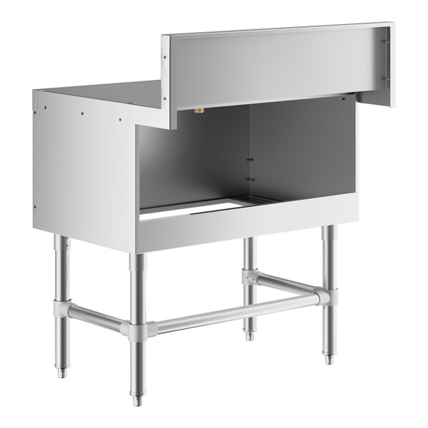 A Regency stainless steel underbar drainboard on a white counter.