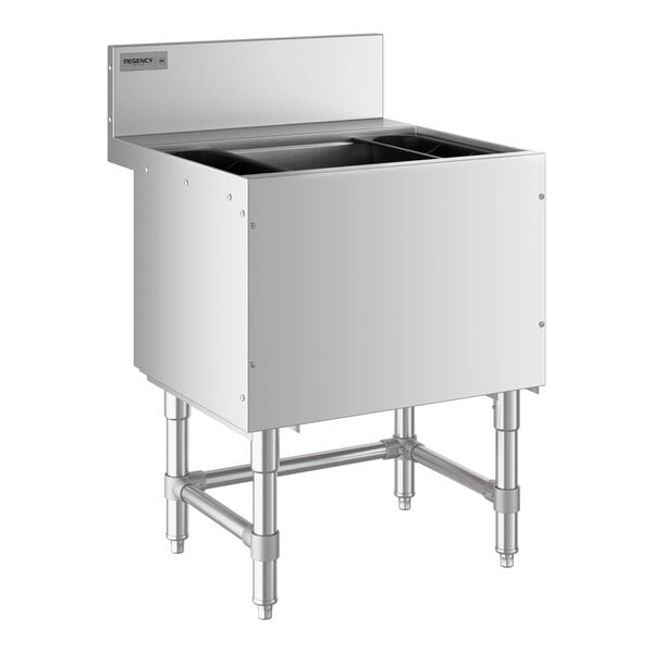 A Regency stainless steel underbar ice bin with a cold plate and bottle holders on a counter.