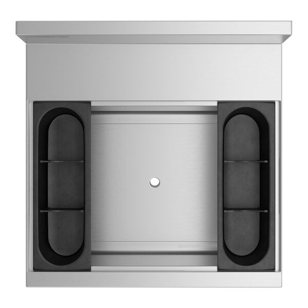 A top view of a stainless steel Regency underbar ice bin with a cold plate and bottle holders.