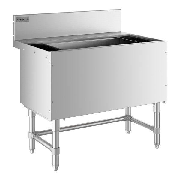 A Regency stainless steel underbar ice bin with a metal frame holding two buckets.