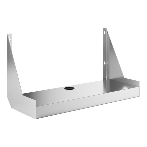 A silver metal Regency Spec Line stainless steel underbar blender shelf with a hole in the middle.