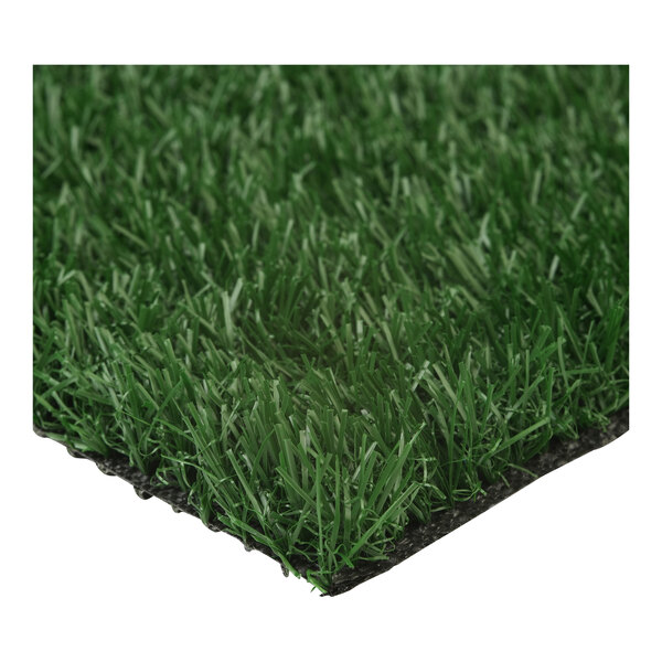 A roll of synthetic grass turf with a green, grass-like surface and a black backing.