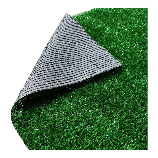 A large roll of synthetic grass with a textured backing, designed for event flooring.