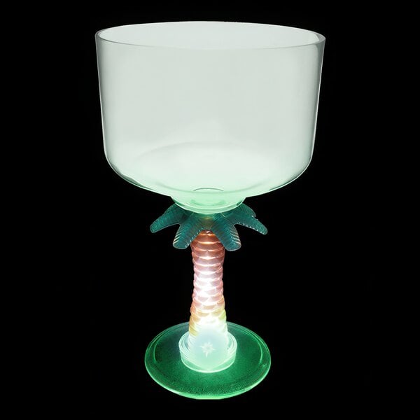 A clear plastic margarita cup with a palm tree stem and green LED light.